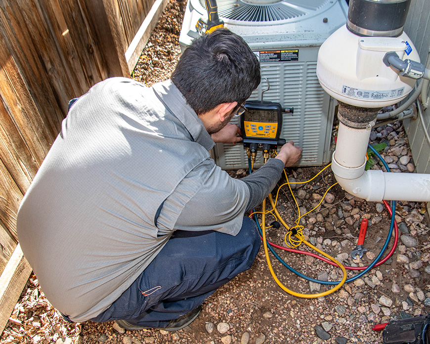 technician repairing ac in fort collins