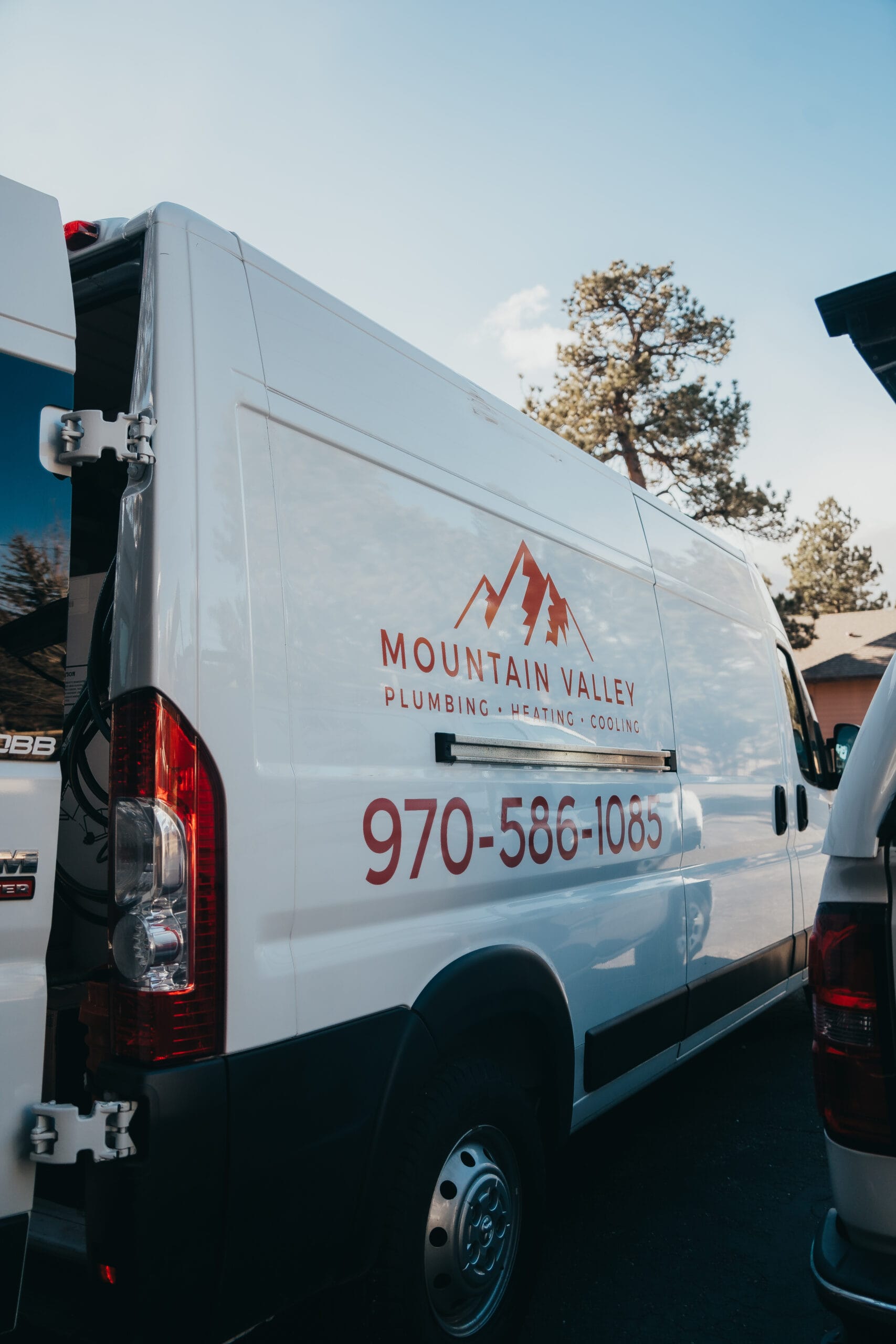 Mountain Valley Plumbing Heating Cooling service van parked outdoors, showing branded vehicle for residential plumbing and HVAC appointments